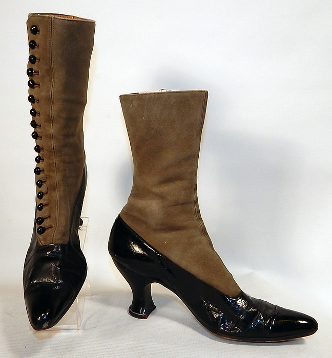 Victorian Women's Antique Gray Suede Black Patent Leather High Top Button Boots
These antique boots are difficult to size for today's foot, but my guess would be approximately a US size 7 narrow width. They are gently worn and in good condition. These are truly a rare color and beautiful quality made antique boot! 