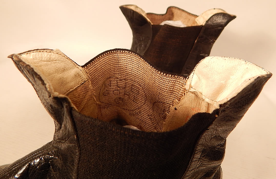 Unworn Antique Victorian Black Leather Hub Gore Elastic Side Dainty Ankle Half Boots
These are truly a rare and wonderful pair of antique Victoriana shoe art!