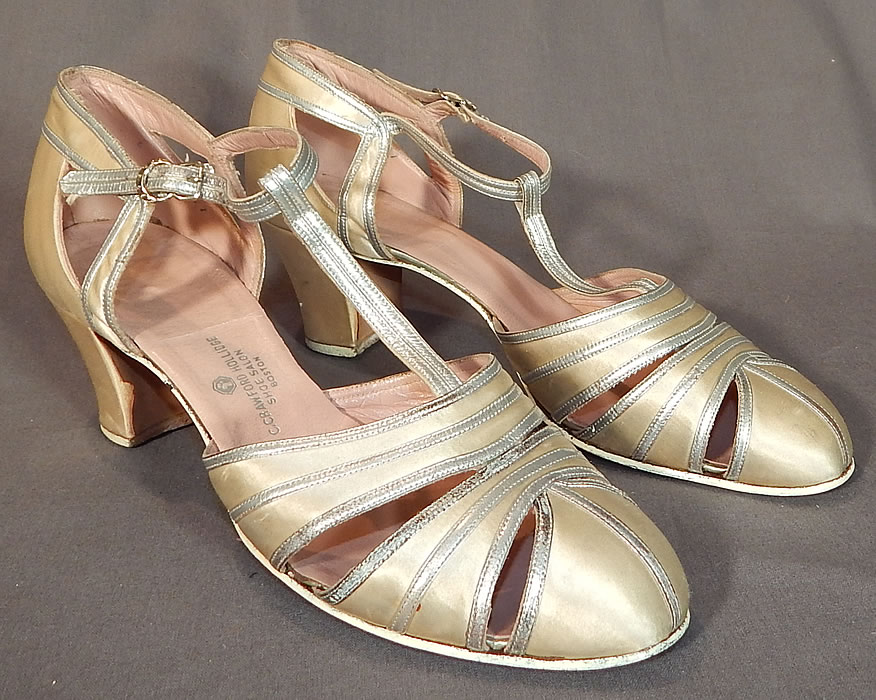 Vintage C. Crawford Hollidge Shoe Salon Cream Silk Satin Silver Leather T-Straps
This pair of vintage C. Crawford Hollidge Shoe Salon cream silk satin silver leather T-straps date from the 1930s. They are made of an off white cream color silk satin fabric, with silver metallic leather trim edging.