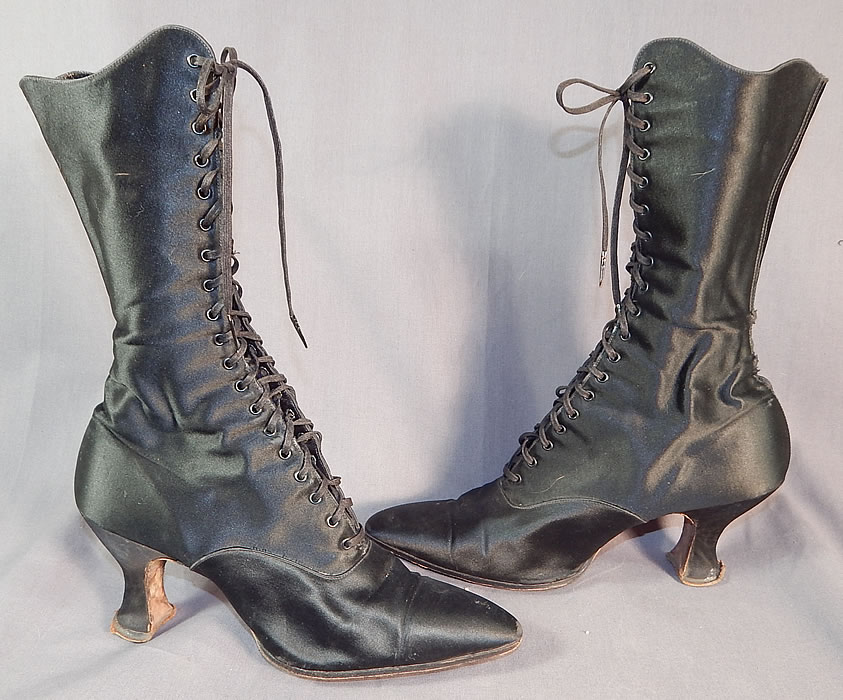 Victorian Vintage Oppenheim Collins & Co. Black Silk Satin High Top Lace-up Boots
This pair of vintage Oppenheim Collins & Co. Victorian era antique black silk satin high top lace-up boots dates from 1900.