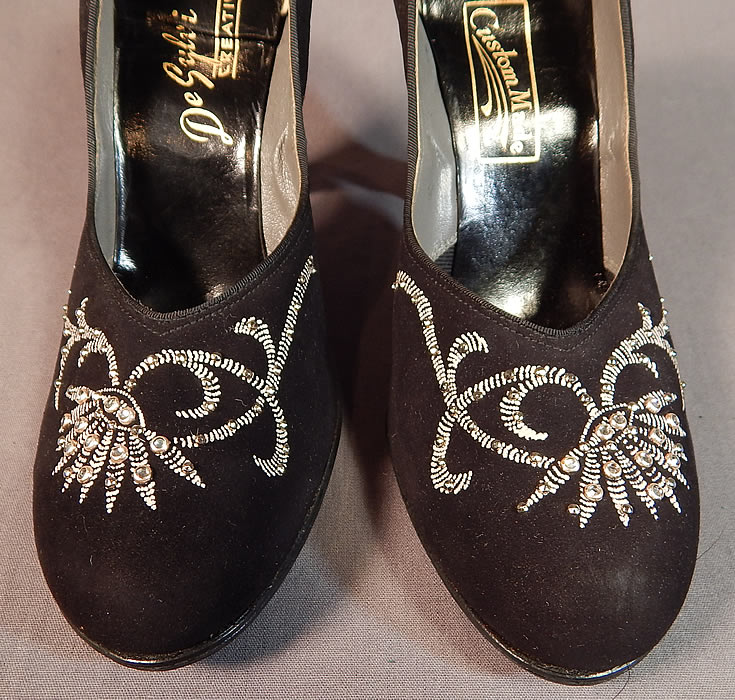 Vintage De Sylvi Creation Hand Painted Black Suede Leather Rhinestone Beaded Shoes
This pair of vintage De Sylvi Creation hand painted black suede leather rhinestone beaded shoes date from the 1940s. 