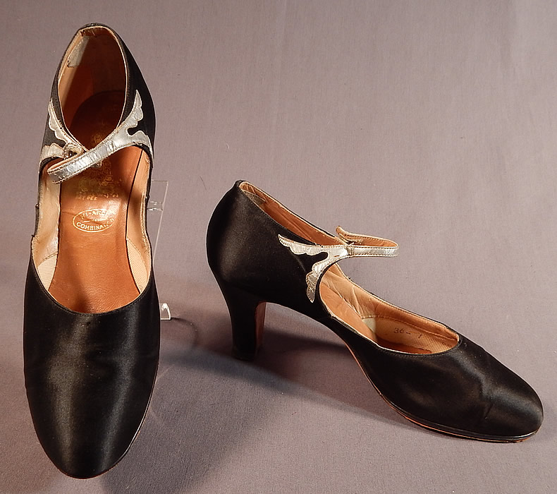 Vintage Peacock Shoe Art Deco Black Silk Satin Silver Button Strap Mary Jane Shoes
These beautiful black evening flapper dance shoes have a Mary Jane style with button strap closure across the instep, rounded toes and black satin covered modified boulevard high heels.