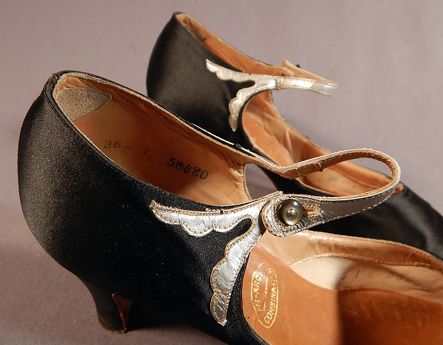 Vintage Peacock Shoe Art Deco Black Silk Satin Silver Button Strap Mary Jane Shoes
The shoes measure 9 inches long, 2 3/4 inches wide, with 2 1/2 inch high heels and are approximately a size 7. 
