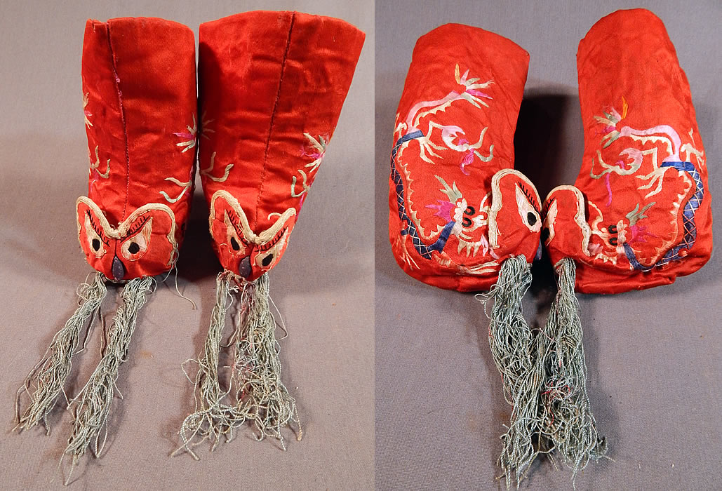 Antique Chinese Child's Red Silk Embroidered Dragon Baby Booties Boots Shoes
This pair of vintage antique Chinese child's red silk embroidered dragon baby booties boots shoes date from the 1920s. They are made of a red silk fabric, with colorful hand embroidery work of dragons along the sides and creating a cute three dimensional animal face on the fronts with long blue silk fringe whiskers.