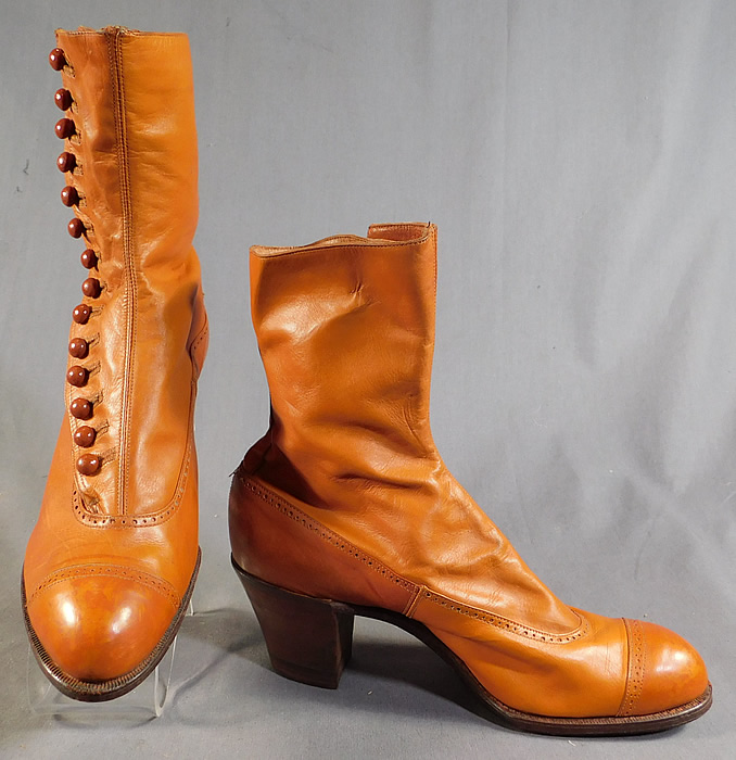 Edwardian Vintage Unworn Womens Tan Leather High Top Button Boots
These beautiful boots have rounded toes, 14 brown shoe buttons along the side for closure and stacked wooden cube heels.