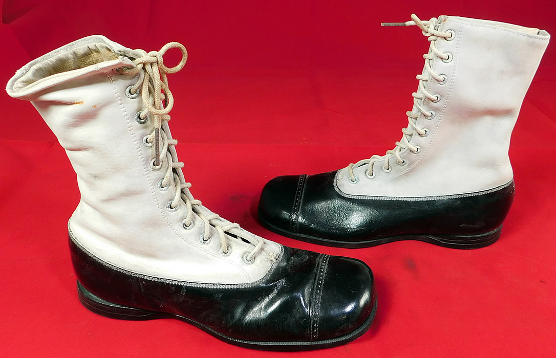 Unworn Vintage Doctor Deans Edwardian Two Tone Black & White Leather High Top Boots
The boots measure 6 1/2 inches tall, 7 1/2 inches long, 2 1/2 inches wide and a 1/2 inch high heel.