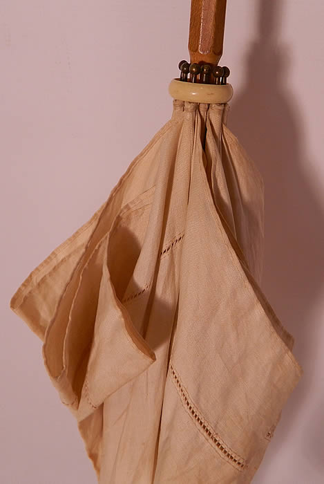 Edwardian Ecru Linen Carved Wood Handle Summer Pagoda Parasol. There is a hand carved engraved wood handle and finial top with gathered scrunchie fabric trim. 
