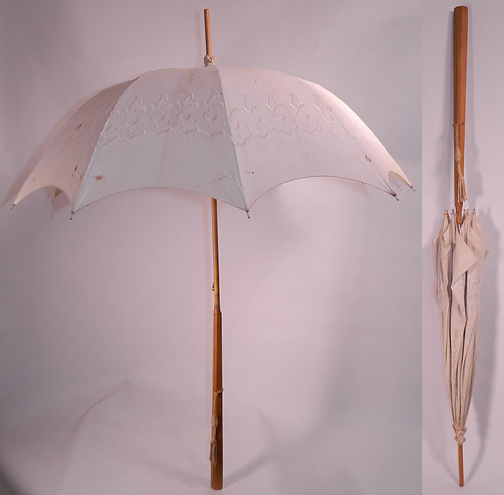 Edwardian Embroidered White Linen Wood Handle Summer Pagoda Parasol. This pretty parasol umbrella has a pagoda dome shape and white painted metal frame inside. The parasol measures 40 inches long and 100 inches in circumference when opened. 