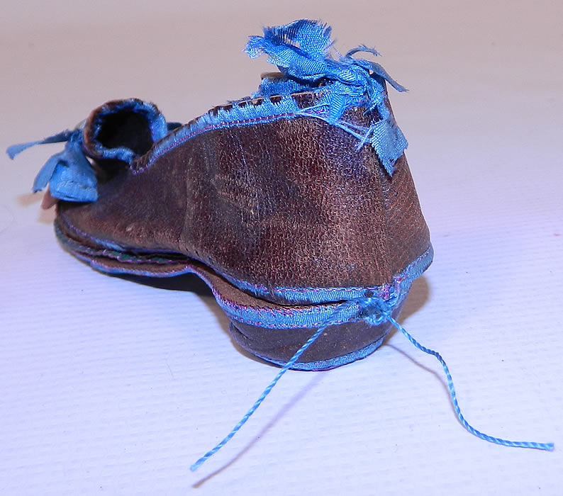 Antique Victorian Sewing Shoe Etui Needle Case Thimble Holder. It is in good condition, with only some  wear along the blue silk ribbon edging which is frayed and missing in areas. This is truly an amazing and rare unique piece of collectible antique sewing necessaire!