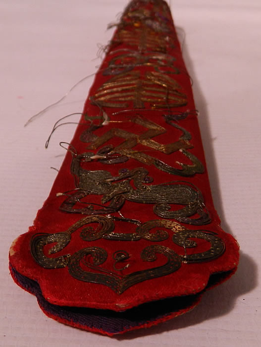 Antique Chinese Red Silk Gold Couching Bat Ji Swastika Fan Case Holder Purse. There are precious objects of coins, bats, ji & xi characters for luck, joy and the swastika for longevity. This beautiful long purse would have held a Chinese hand fan and would have been attached along the belted waist since there were no pockets on clothing for carrying. The case measures 12 inches long and is 2 inches wide. It is in as-is fair condition, with several loose gold threads couching work and some fraying of the silk fabric bottom. This is truly a wonderful piece of antique Chinese textile art!