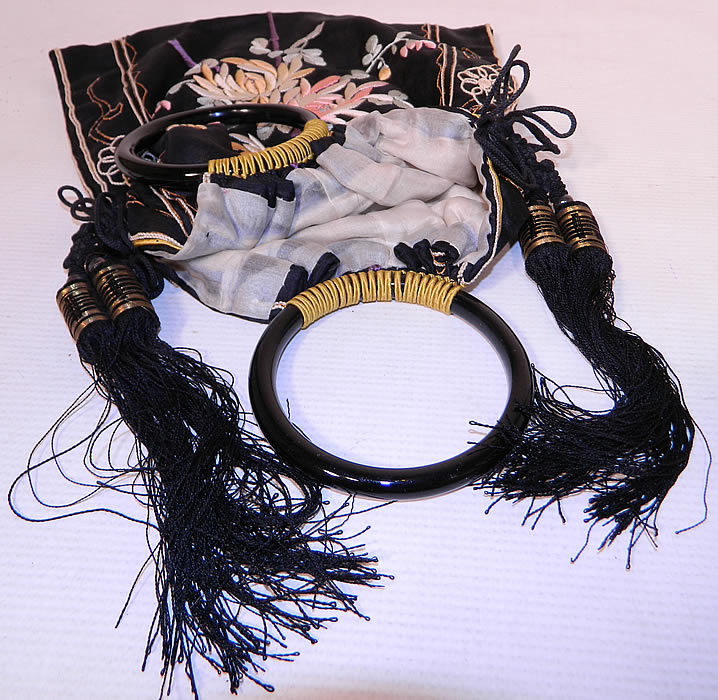 Antique Chinese Silk Embroidered Spider Chrysanthemum Tassel Purse. It is fully lined inside in silk, with  4 inch long black  silk tassels knotted on each side for decoration. The  purse measures 13 by 10 inches. It is in excellent condition. This is truly a wonderful one of a kind piece of antique Chinese textile art!