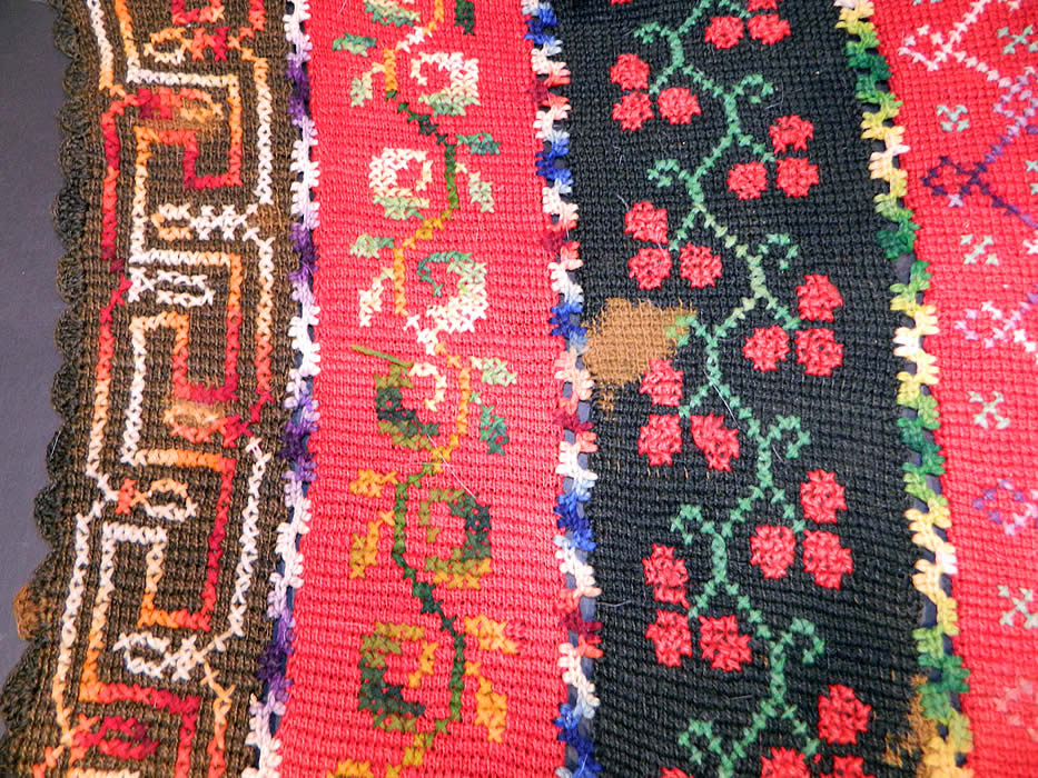 Victorian Antique Colorful Wool Hand Knit Embroidered Fringe Striped Shawl Blanket. The shawl  measures 69 inches long and 31 inches wide. It is in good condition, with some missing fringe trim, a  break in the knit trim and a few small fade age spot stains (see close-ups). This is truly a wonderful example of antique hand knit textile art! 
