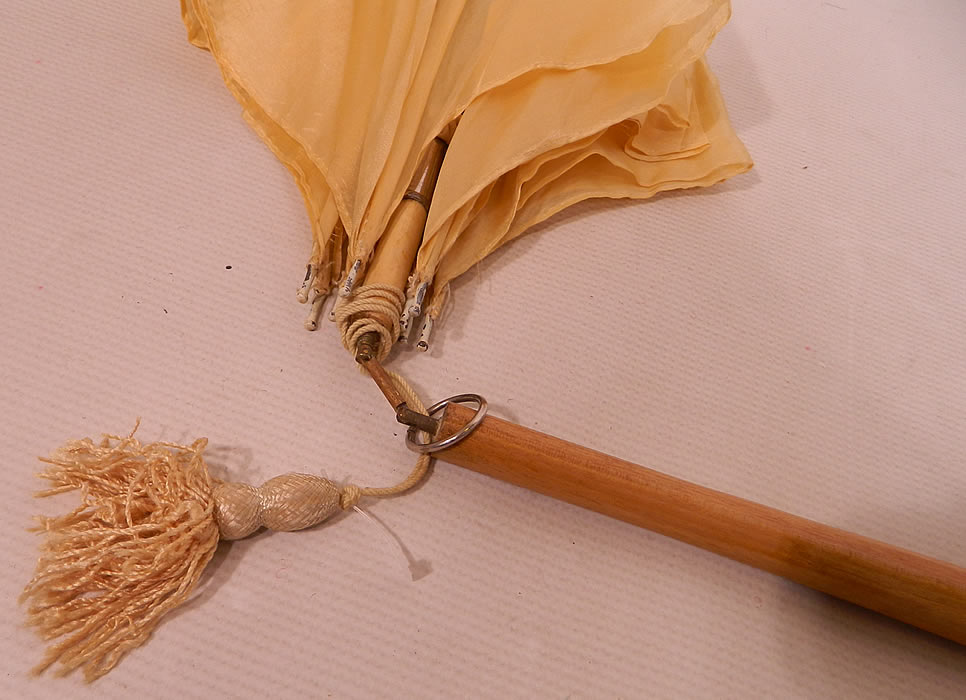 Edwardian Ecru Cream Silk Embroidered Folding Wood Handle  Pagoda Parasol. It is in good useable condition, with only the handle being slightly bent and crooked. This is truly a wonderful parasol perfect for an Edwardian era ladies summer outing! 