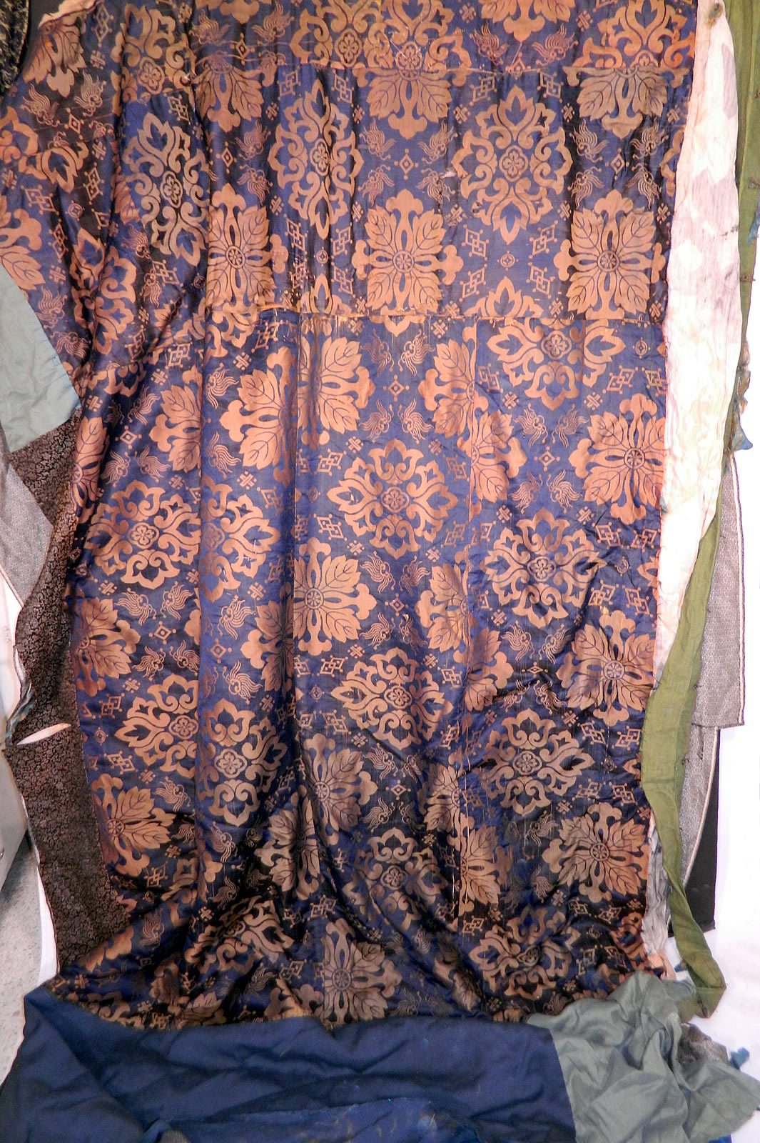Antique Japanese Silk Embroidered Couching Dragon Birds Wall Hanging Tapesrty. It is pieced, backed in a variety of fabrics, blue & gold silk fabric with a floral design and a black & gold damask brocade crane pattern fabric trim. 