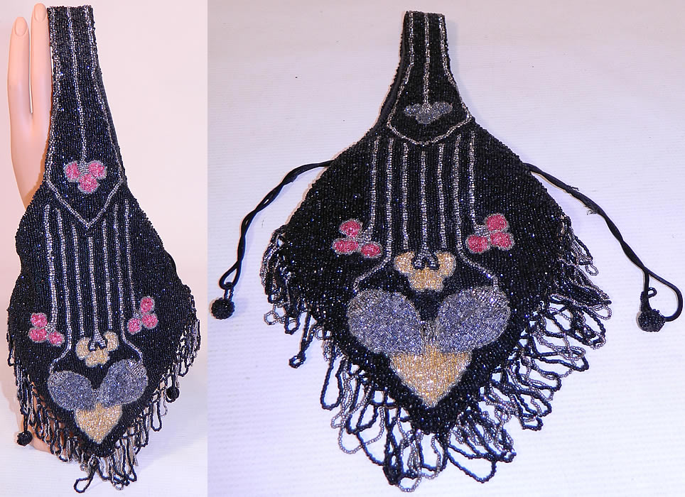 Vintage Art Deco Black & Silver Beaded Fringe Drawstring Flapper Purse
This vintage Art Deco black and silver beaded fringe drawstring flapper purse dates from the roaring 1920s. It is hand beaded with primarily black & silver beads, with an abstract Art Deco design done in pink, yellow and blue beading on both sides.