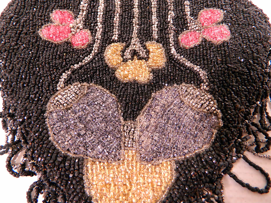 Vintage Art Deco Black & Silver Beaded Fringe Drawstring Flapper Purse
The purse measures 15 1/2 inches long and 7 inches wide. It is in good condition, with no loose or missing beads, just a small fray on the silk drawstring rope strap. This is truly a wonderful piece of antique beaded Art Deco textile art! 