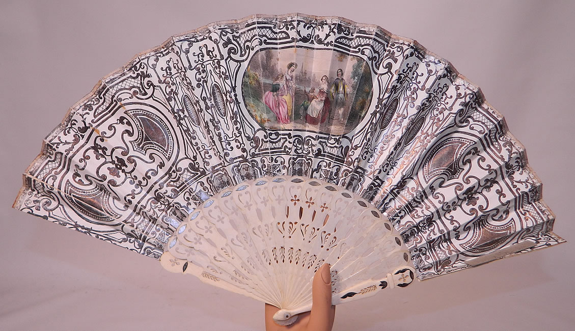 Victorian Lithograph Silver Foil Inlay Pierced Pleated Folding Fan
This fabulous folding fan has elaborate intricately carved and pierced bone sticks and guards, with silver foil inlay accents and a mother of pearl rivet holding the fan together at the bottom. 