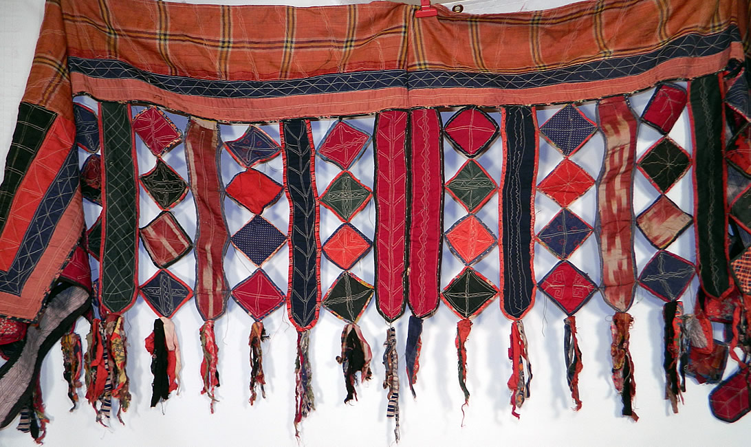 Antique Uzbekistan Tajik Ikat Patchwork Quilt Fabric Textile Door Curtain Wall Hanging
There are hand embroidered decorative stitching quilted details with fringed fabric ragged tassel ends. 