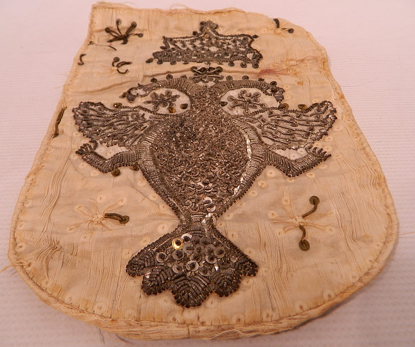 Antique 18th Century Silver Stumpwork Beaded Heraldic Heraldry Coat of Arms Russia
This rare early coat of arms of the Russian Empire has the double headed Imperial eagle and crown above, derived from its medieval Byzantine origins. It is backed and lined on a linen fabric with padding inside. 