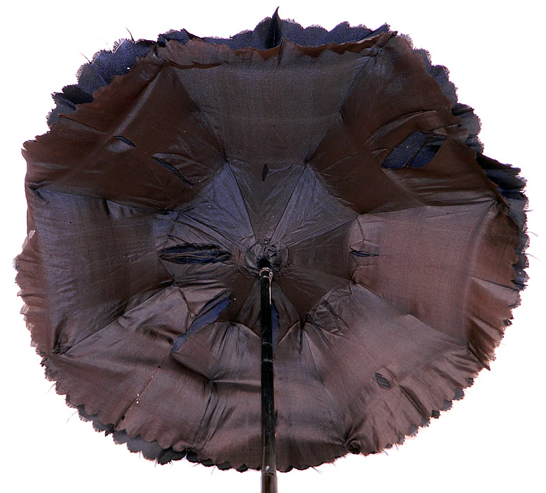 Victorian Civil War Black Silk Folding Handle Marquis Mourning Parasol
It is fully lined inside with a black silk fabric. The parasol measures 28 inches long extended, 15 inches long when folded and the fabric outside is 64 inches in circumference when opened up. 