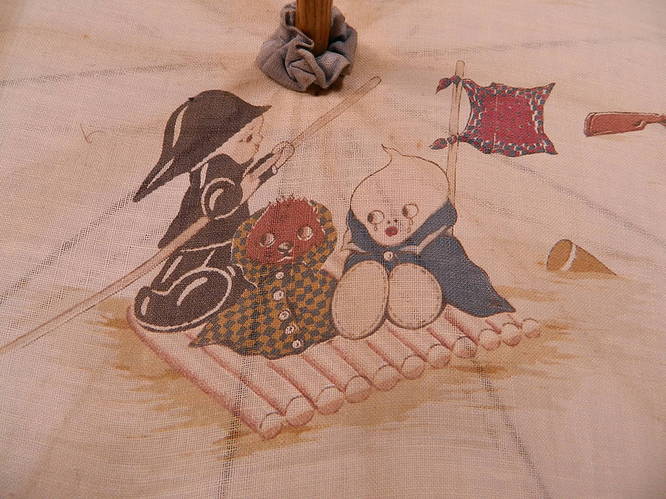 Vintage Chloe Preston Childrens Kewpie Illustration Print Linen Parasol
It is made of an off white linen fabric, with muted color cute snub nosed children Kewpie like and animals at play in adult guise illustrations by the British children's artist Chloe Preston.