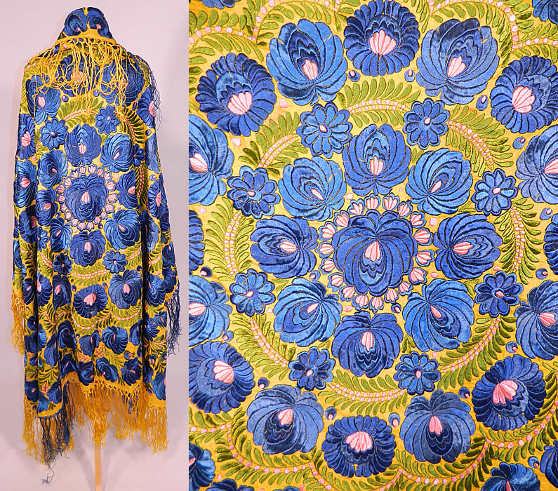 Antique Matyo Hungarian Folk Embroidery Fringe Large Square Shawl Tablecloth
This antique Hungarian Matyo folk embroidery fringe large square shawl tablecloth dates from the 1920s. It is hand stitched, made of a bright yellow linen cloth completely covered with blue, green and pink silk threads done in raised padded satin stitch Matyo embroidery work.