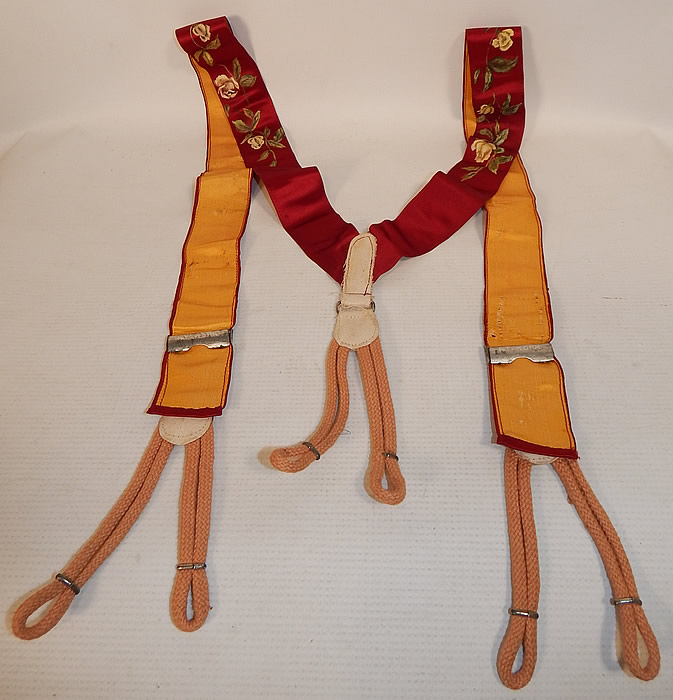 Victorian Red Silk Hand Painted White Rosebud Roses Suspenders Braces
These dashing dapper gentleman's suspenders are backed in a golden yellow color silk fabric, with white twill trim, peach rope button loop attachments and embossed silver metal hardware adjustable brackets on the front.