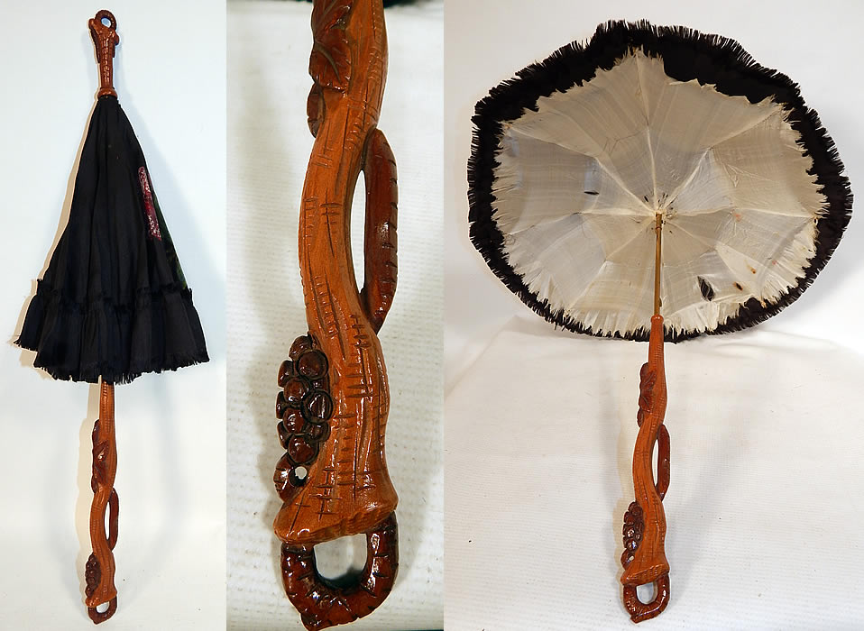 Victorian Black Silk Hand Painted Roses Grape Leaf Wood Carved Handle Parasol
This antique Victorian era black silk hand painted roses grape leaf wood carved handle parasol dates from the 1870s. It is made of a black silk fabric with hand painted red roses and a frayed edge scalloped ruffle trim edging