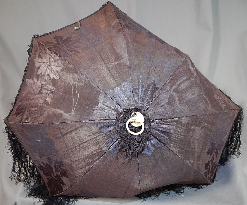 Victorian Antique Black Silk Damask Maple Leaf Carved Wood Folding Handle Parasol
The parasol measures 28 inches long extended, 16 inches long when folded, the fabric cover is 10 inches long, 20 inches wide and has 4 inch long fringe trim.