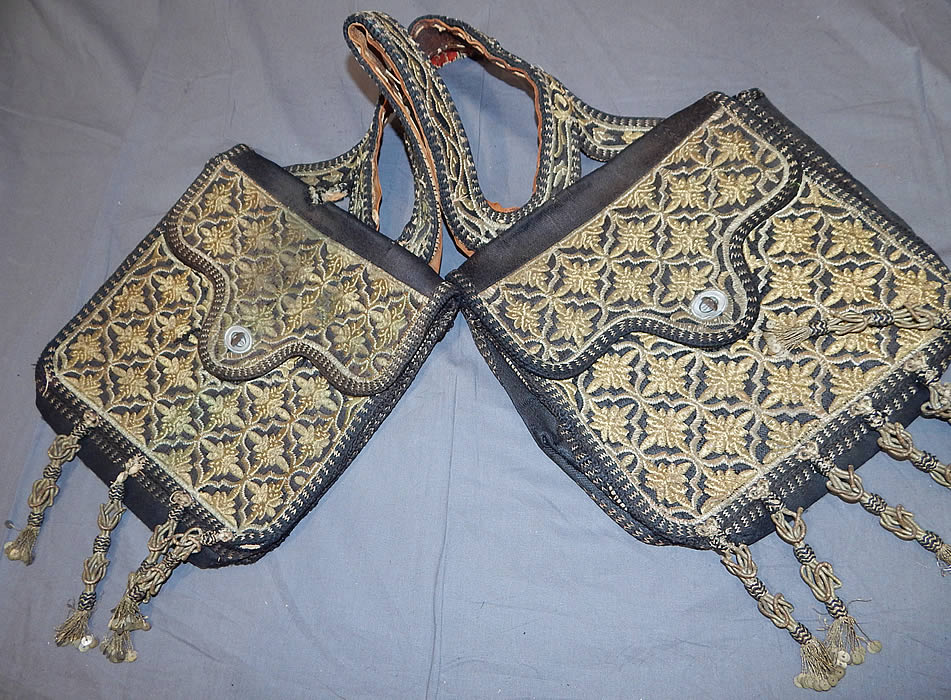 Moroccan Antique Gold Metallic Embroidered Double Saddle Messenger Bag
Each bag measures 12x12 inches, with a 14 inch shoulder strap connecting them and 4 1/2 inch long tassels. It is in good as-is condition, with some wear and is missing 1 tassel. This is truly a wonderful one of a kind piece of antique tribal ethnic embroidered Moroccan textile art!