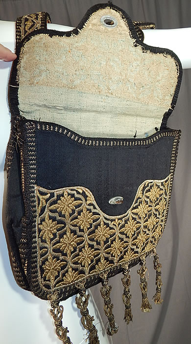 Moroccan Antique Gold Metallic Embroidered Double Saddle Messenger Bag
It is attached at the top with leather backed straps and has an envelope style pouch with metal fasteners and lined inside in a homespun linen.