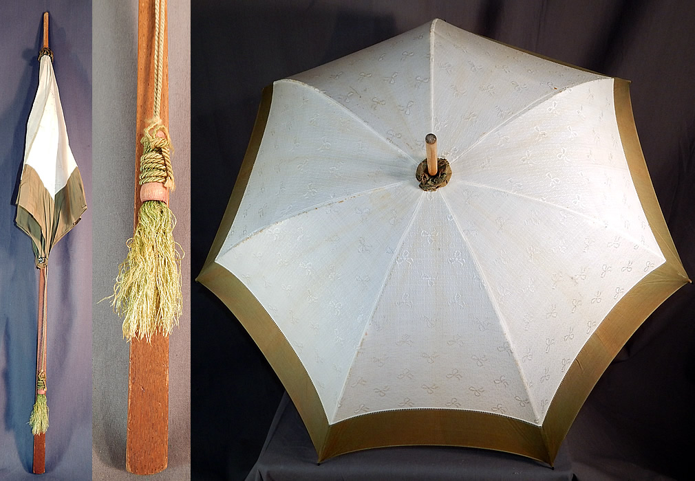 Edwardian White Cotton Damask Bow Green Trim Wood Handle Summer Parasol
This Edwardian era antique white cotton damask bow green trim wood handle summer parasol dates from 1910.