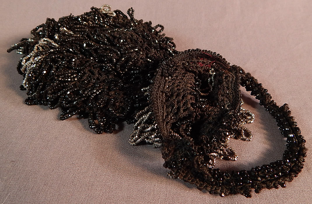 Vintage Art Deco Black Crochet Jet Silver Steel Cut Beaded Drawstring Flapper Purse
This fabulous flapper handbag pouch purse has a drawstring style, with beaded carrying strap, open top, no closure, beaded loop fringe tassel bottom and is unlined